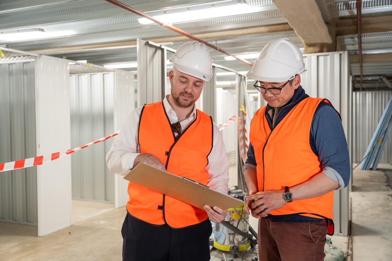 Two engineers going surveying a plan