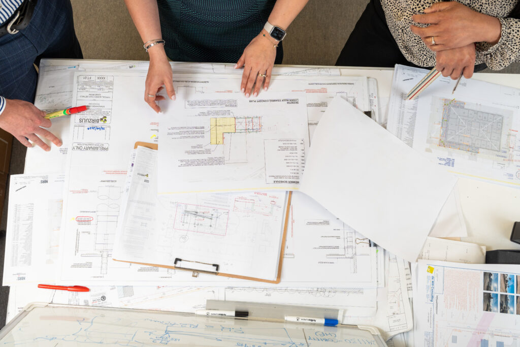 Birzulis engineers going over a plan